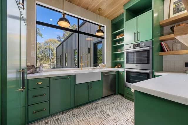 a kitchen with a sink and an oven