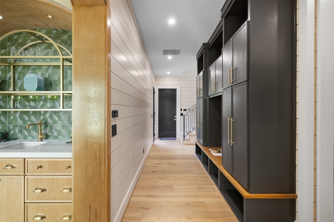 226 Hackemack Road Round Top, TX 78954 - Photo 31 of 50 a view of a hallway with wooden floor and glass door