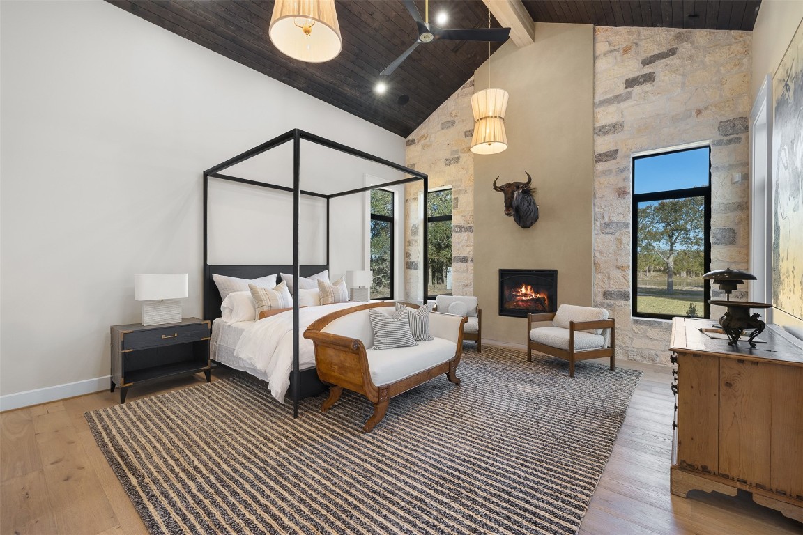 226 Hackemack Road Round Top, TX 78954 - Photo 32 of 50 a spacious bedroom with a bed a couch and dresser