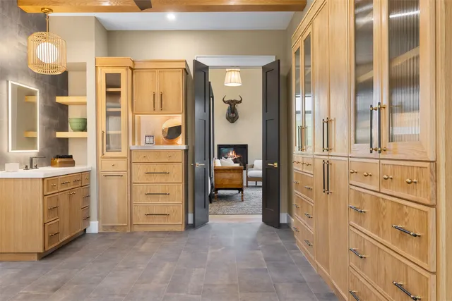 a kitchen with a refrigerator and a cabinets