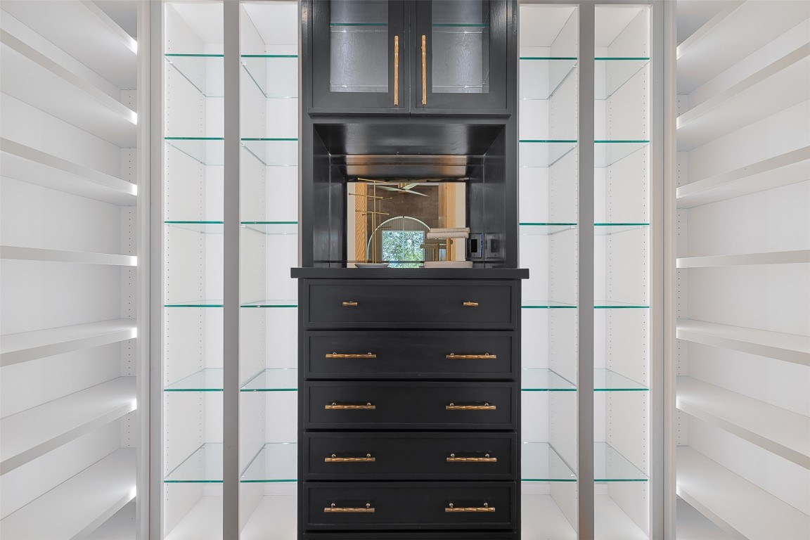 226 Hackemack Road Round Top, TX 78954 - Photo 34 of 50 a kitchen with a refrigerator and a cabinets