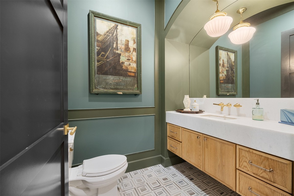 226 Hackemack Road Round Top, TX 78954 - Photo 38 of 50 a bathroom with a toilet sink and mirror