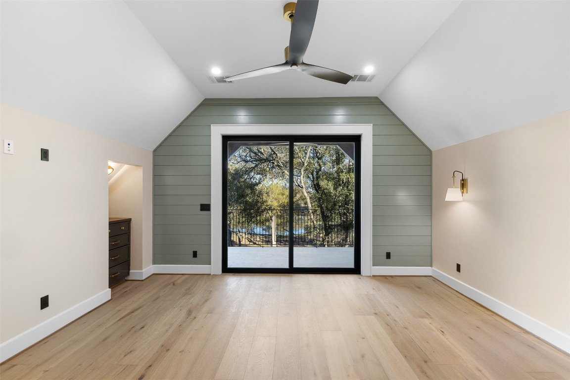 226 Hackemack Road Round Top, TX 78954 - Photo 44 of 50 an empty room with wooden floor and windows