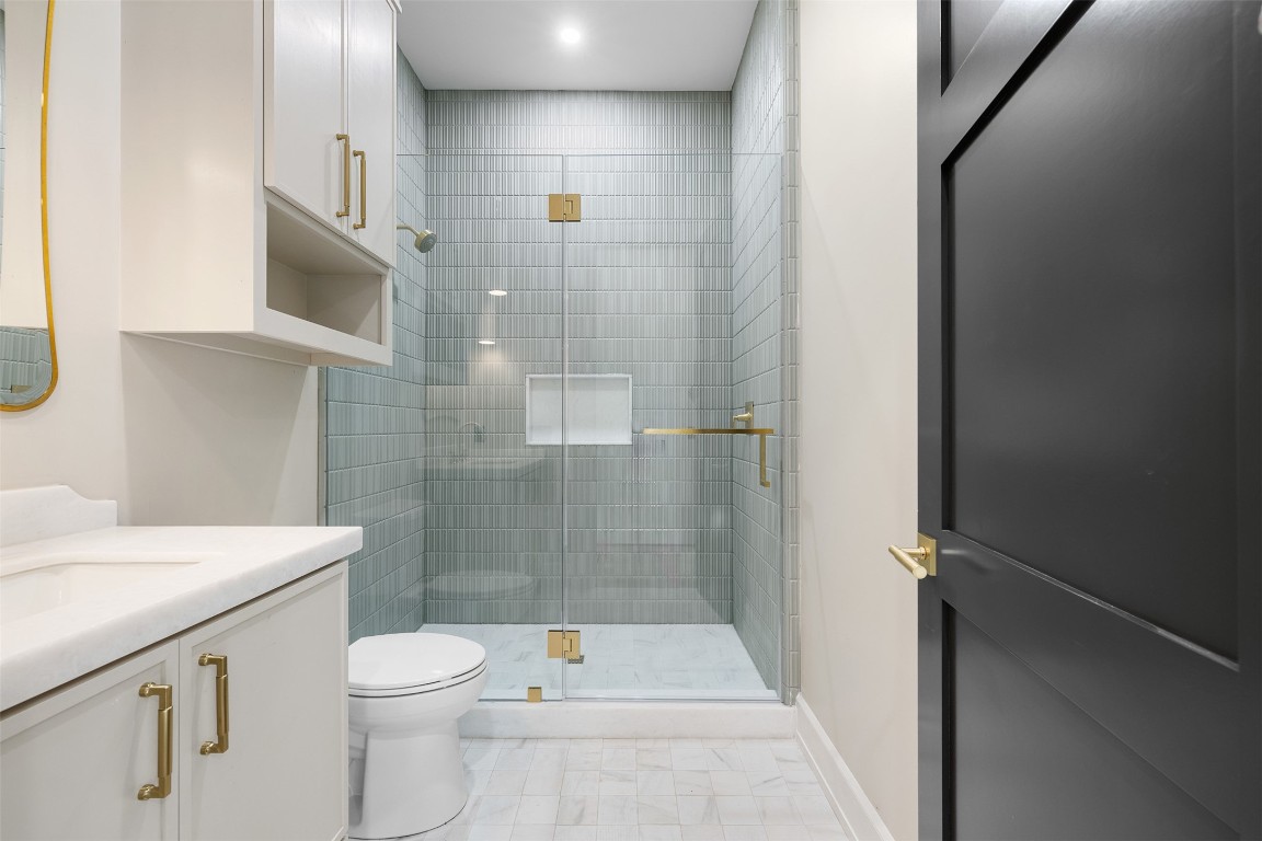 226 Hackemack Road Round Top, TX 78954 - Photo 45 of 50 a bathroom with a shower a toilet and a sink