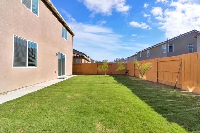 a view of a back yard of the house