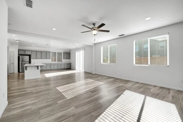 a view of livingroom with hardwood floor and a ceiling fan