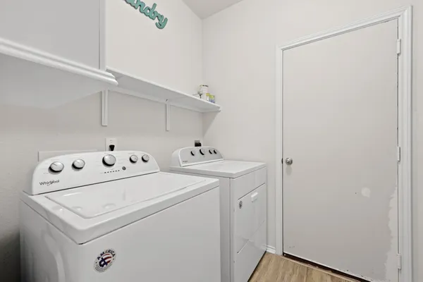 a bathroom with a sink toilet a mirror and shower curtain