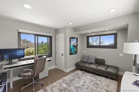 a bathroom with a shower sink and mirror