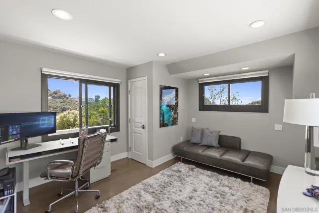 a bathroom with a shower sink and mirror