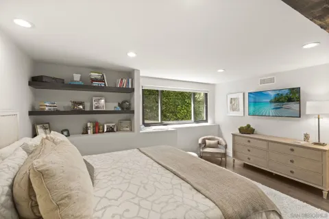 a bathroom with a granite countertop sink mirror and a bathtub