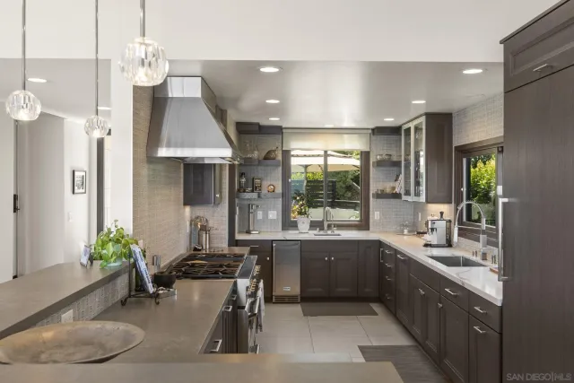 a large kitchen with a table and chairs