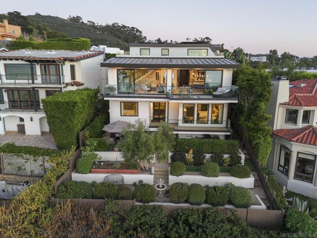 an aerial view of a house with a garden
