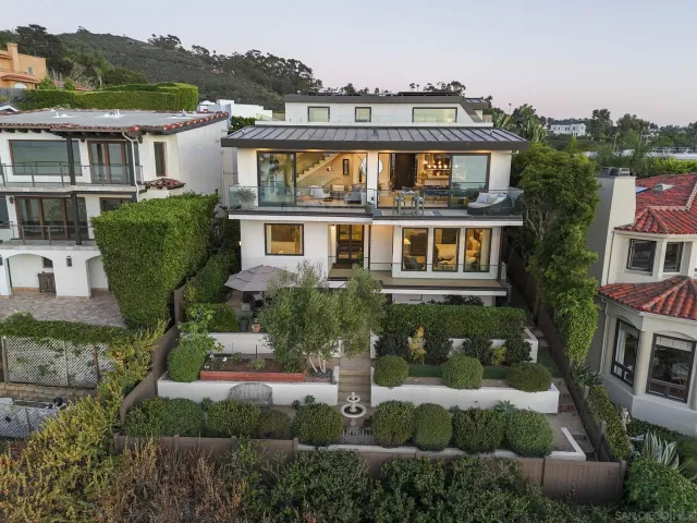 an aerial view of a house with a garden
