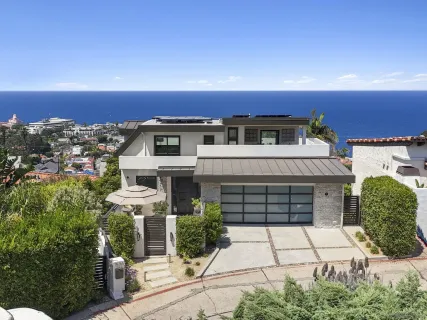 a view of a swimming pool with a table and chairs