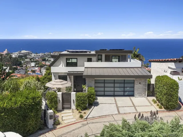 a view of a swimming pool with a table and chairs
