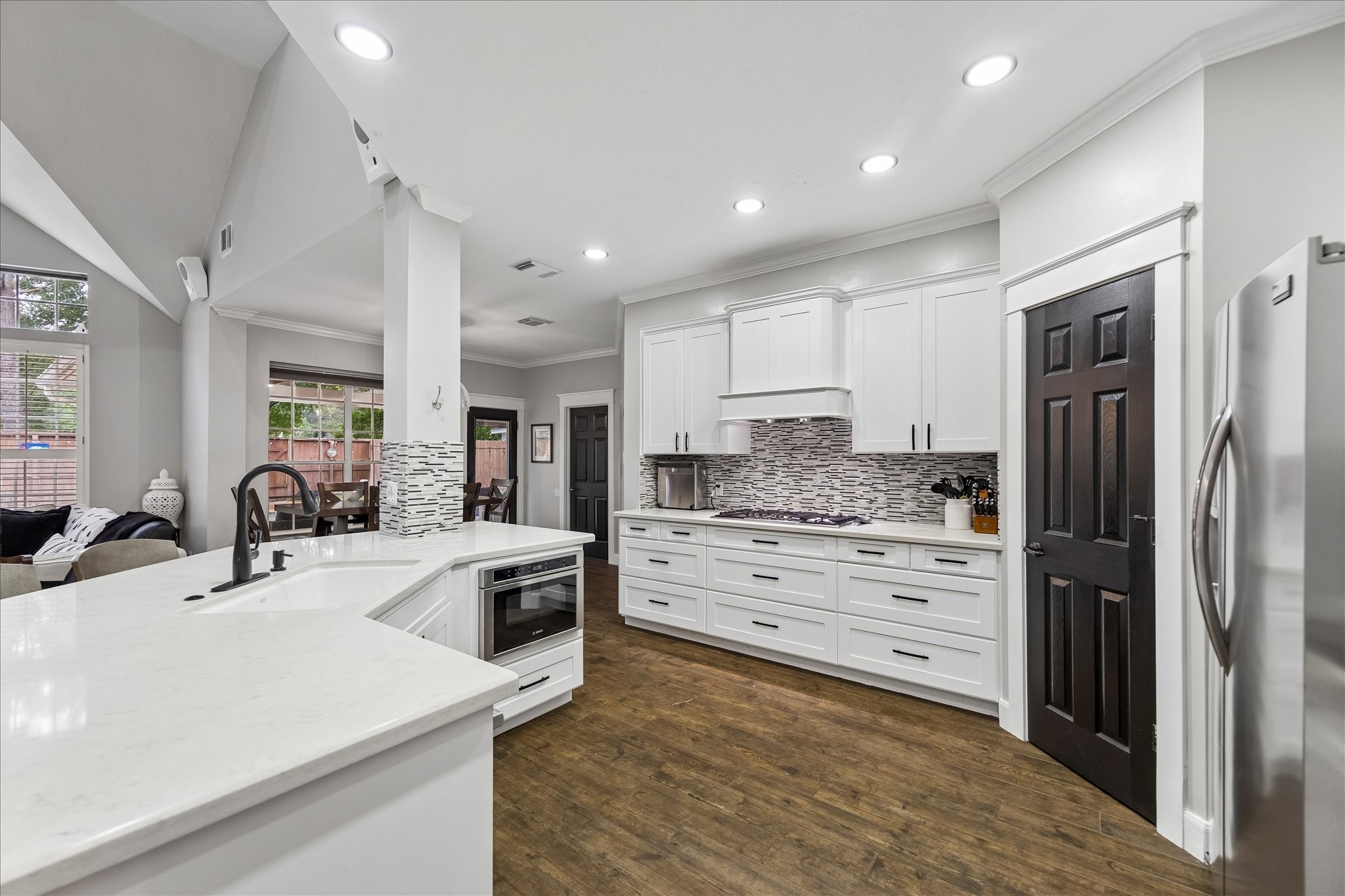 23039 Enchanted Landing Lane Katy, TX 77494 - Photo 11 of 30 a kitchen with a sink stove and refrigerator
