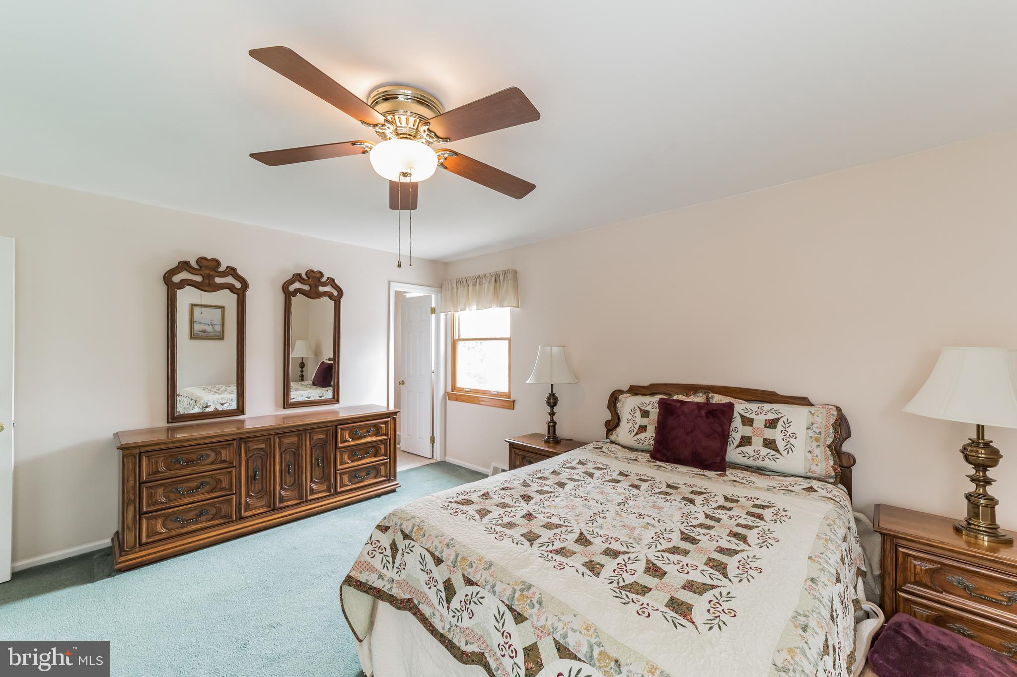 69 St Davids Road Springfield, PA 19064 - Photo 17 of 21 a bedroom with a bed and a chandelier