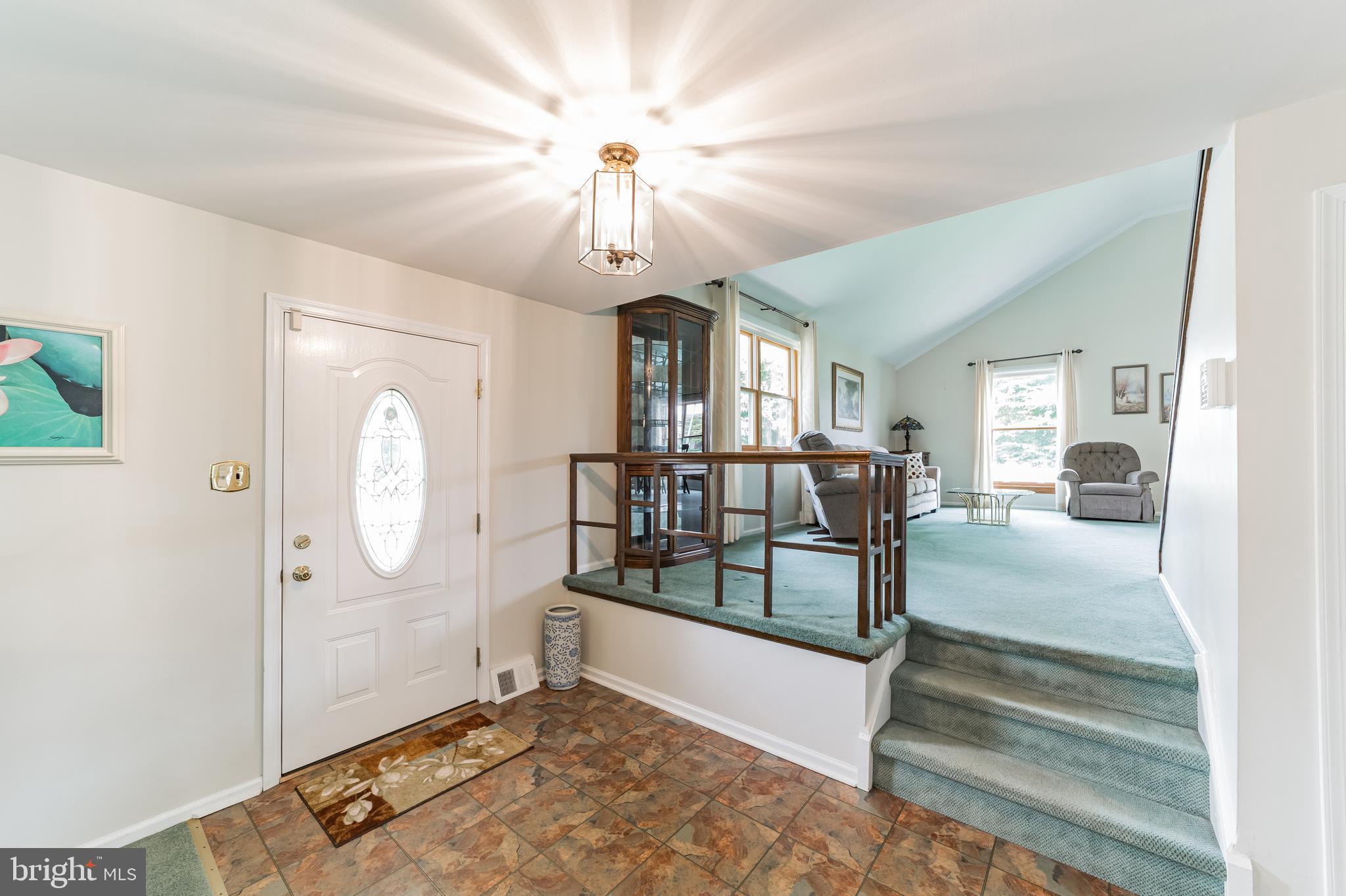 69 St Davids Road Springfield, PA 19064 - Photo 8 of 21 a view of a livingroom with wooden floor and a ceiling fan