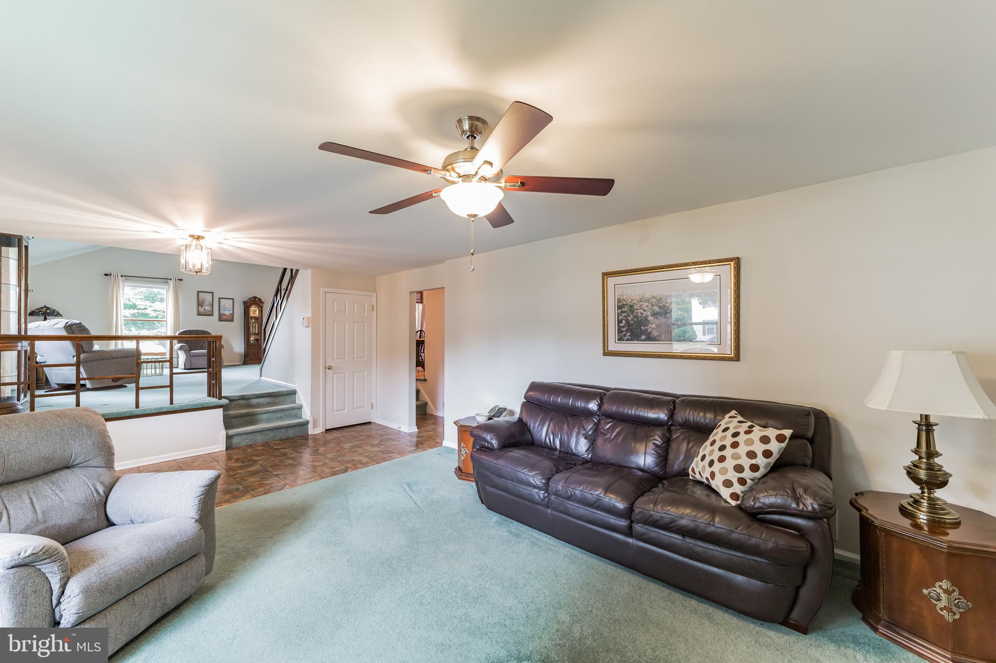 69 St Davids Road Springfield, PA 19064 - Photo 10 of 21 a living room with furniture and a chandelier