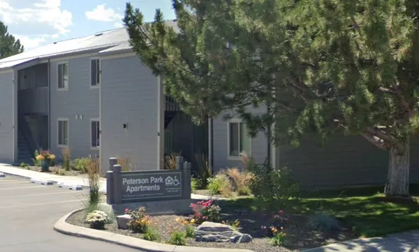 a view of a house with a yard and tree s