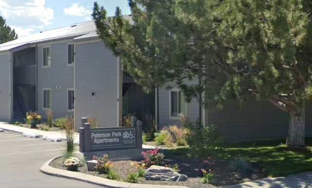 a view of a house with a yard and tree s