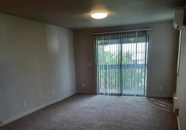 a view of a room with large windows