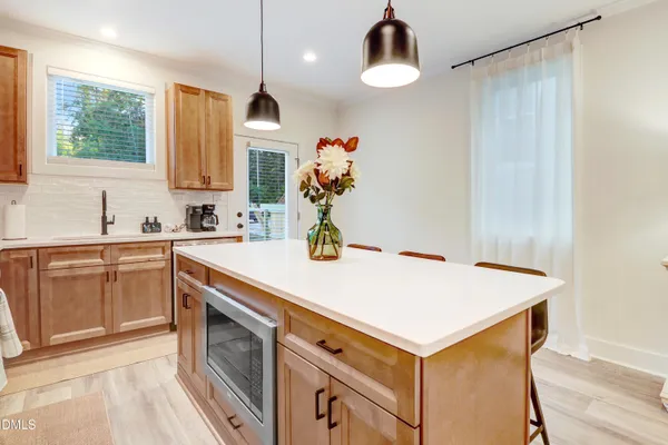 a kitchen with a appliances and a sink