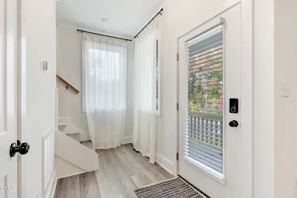 a bathroom with a sink a toilet and a large mirror