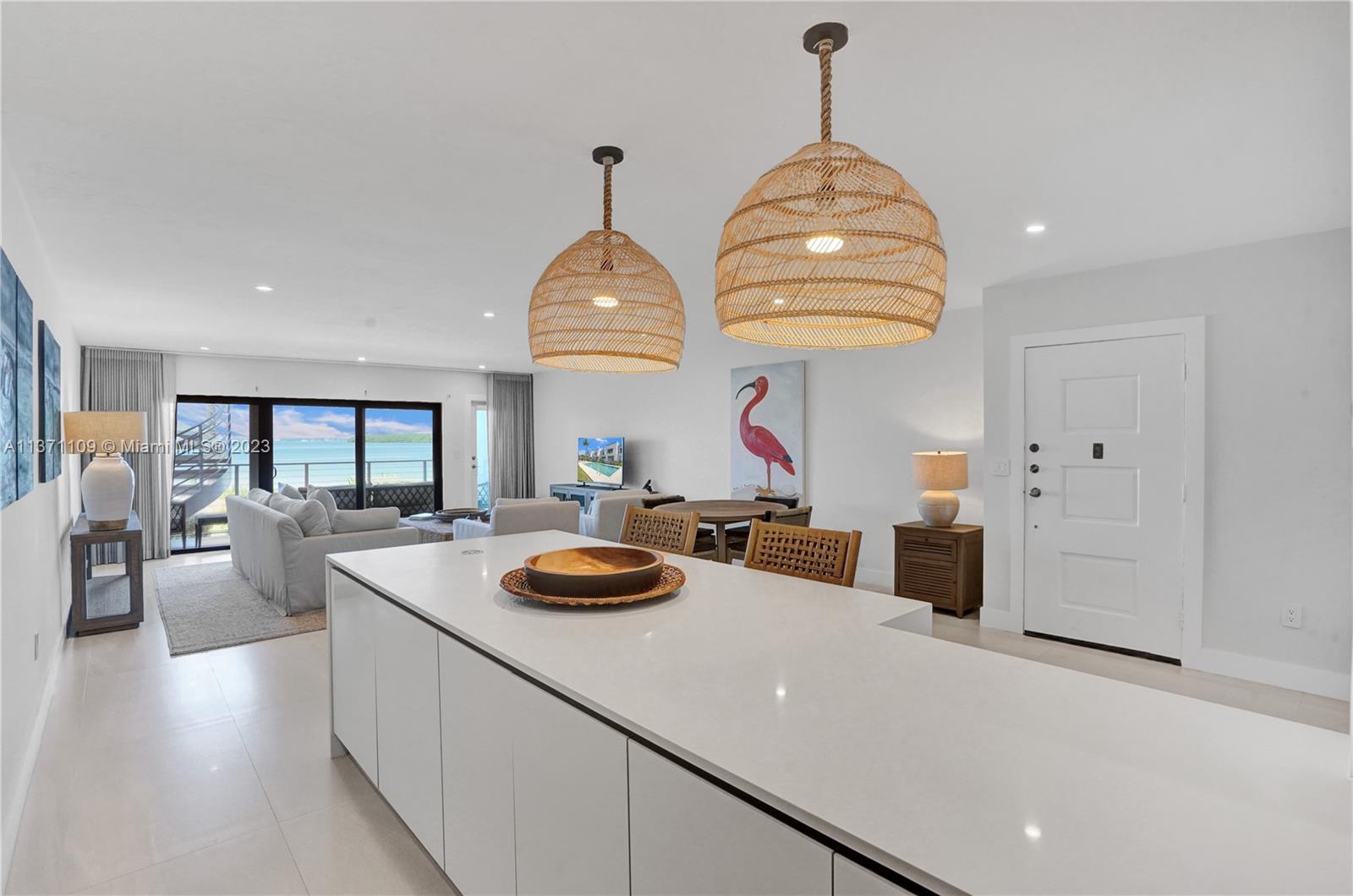 166 Harbor Drive, Unit 3C Key Biscayne, FL 33149 - Photo 12 of 78 a view of a dining room and furniture with large windows
