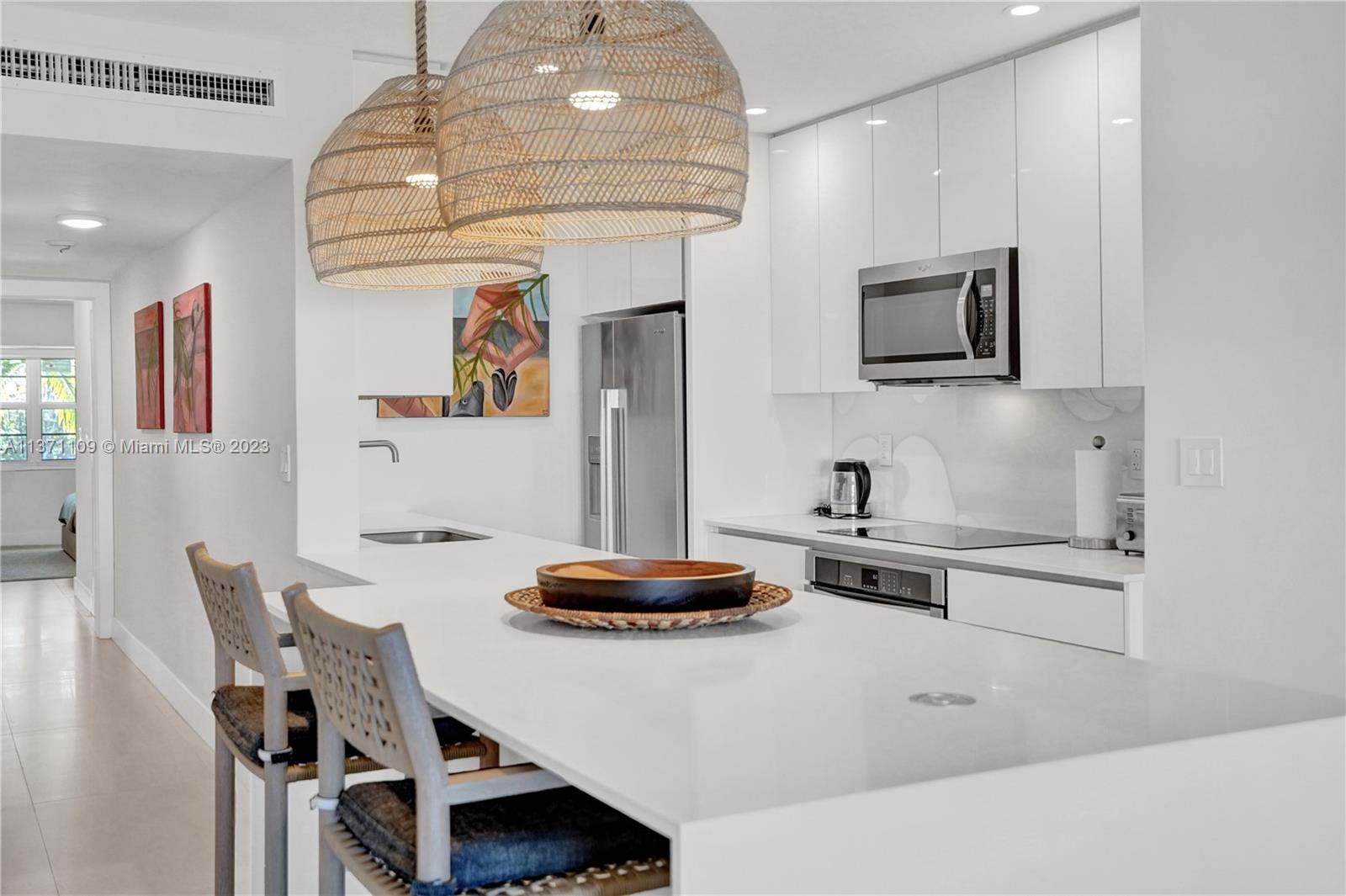 166 Harbor Drive, Unit 3C Key Biscayne, FL 33149 - Photo 15 of 78 a living room with furniture and a flat screen tv