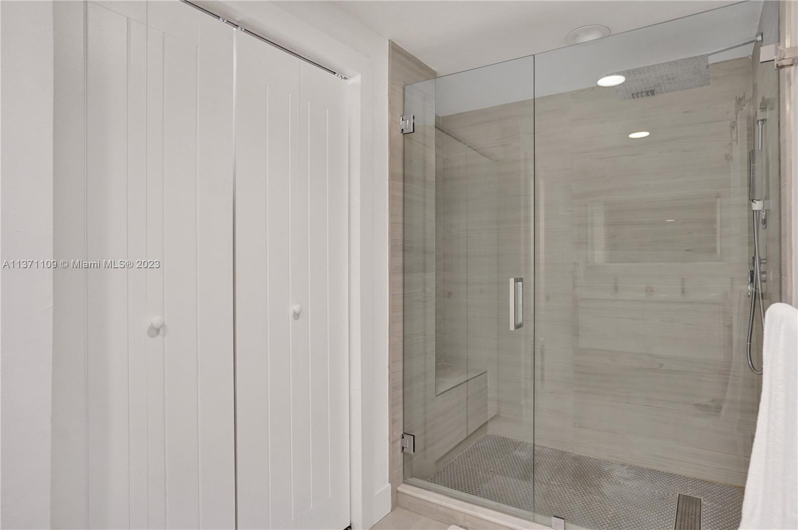 166 Harbor Drive, Unit 3C Key Biscayne, FL 33149 - Photo 24 of 78 a bathroom with a shower and a sink