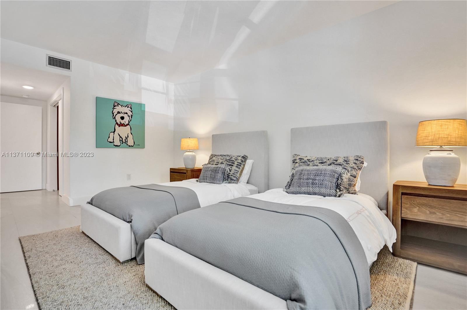 166 Harbor Drive, Unit 3C Key Biscayne, FL 33149 - Photo 28 of 78 a bedroom with two beds and a couch