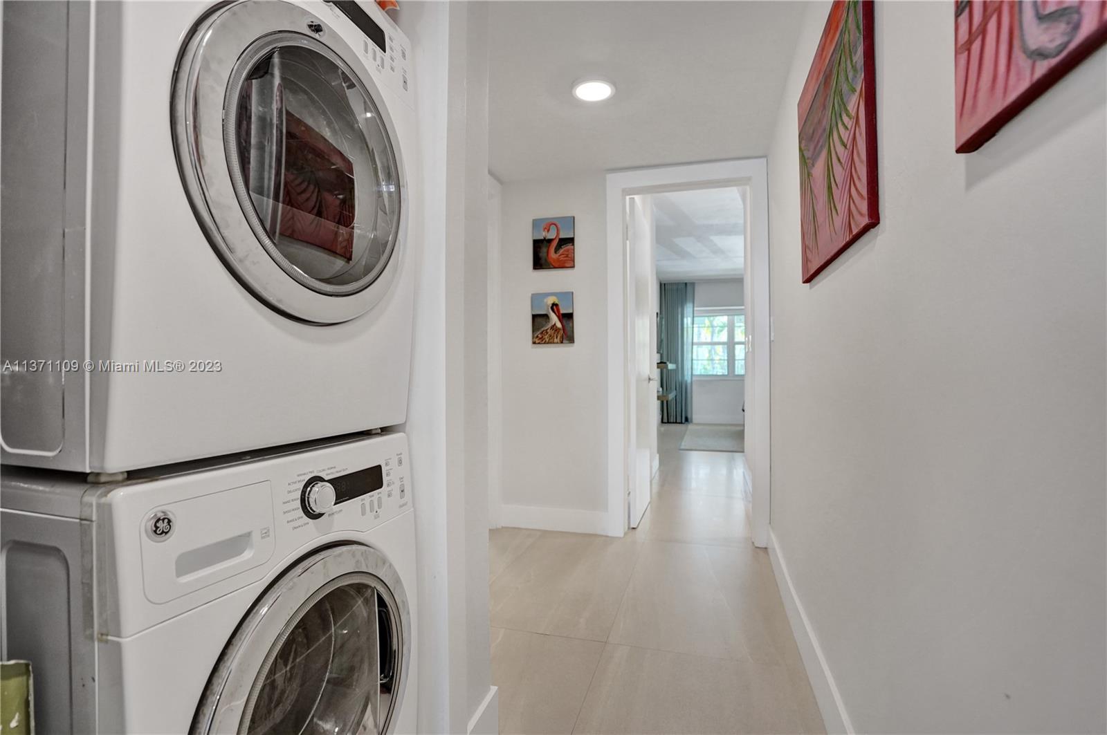166 Harbor Drive, Unit 3C Key Biscayne, FL 33149 - Photo 32 of 78 a view of a hallway with washer and dryer