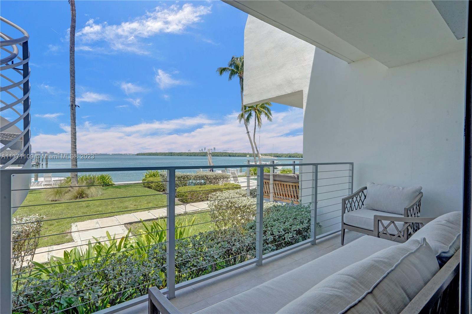 166 Harbor Drive, Unit 3C Key Biscayne, FL 33149 - Photo 39 of 78 a view of a balcony with chairs