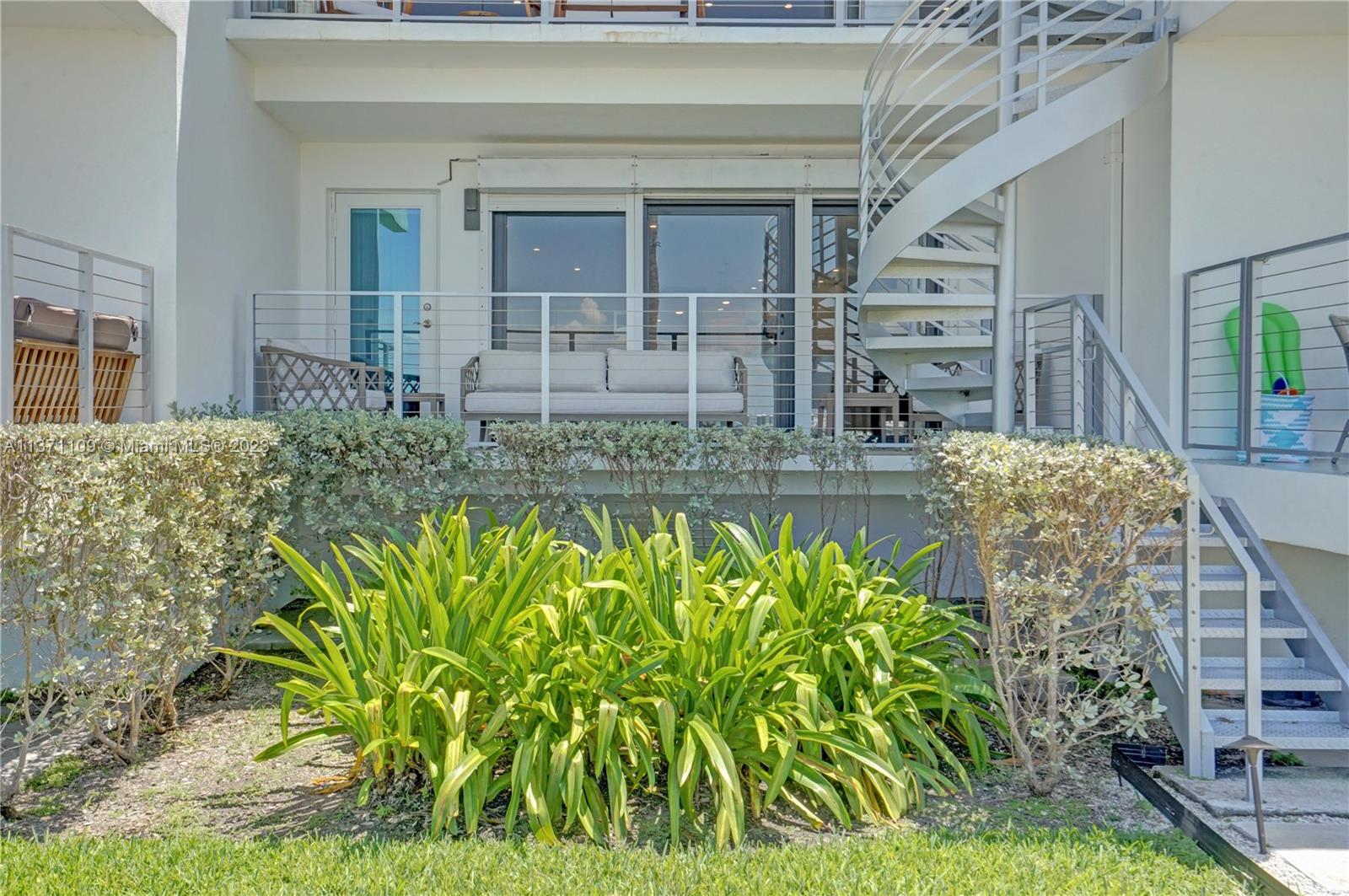 166 Harbor Drive, Unit 3C Key Biscayne, FL 33149 - Photo 41 of 78 a view of a house with potted plants