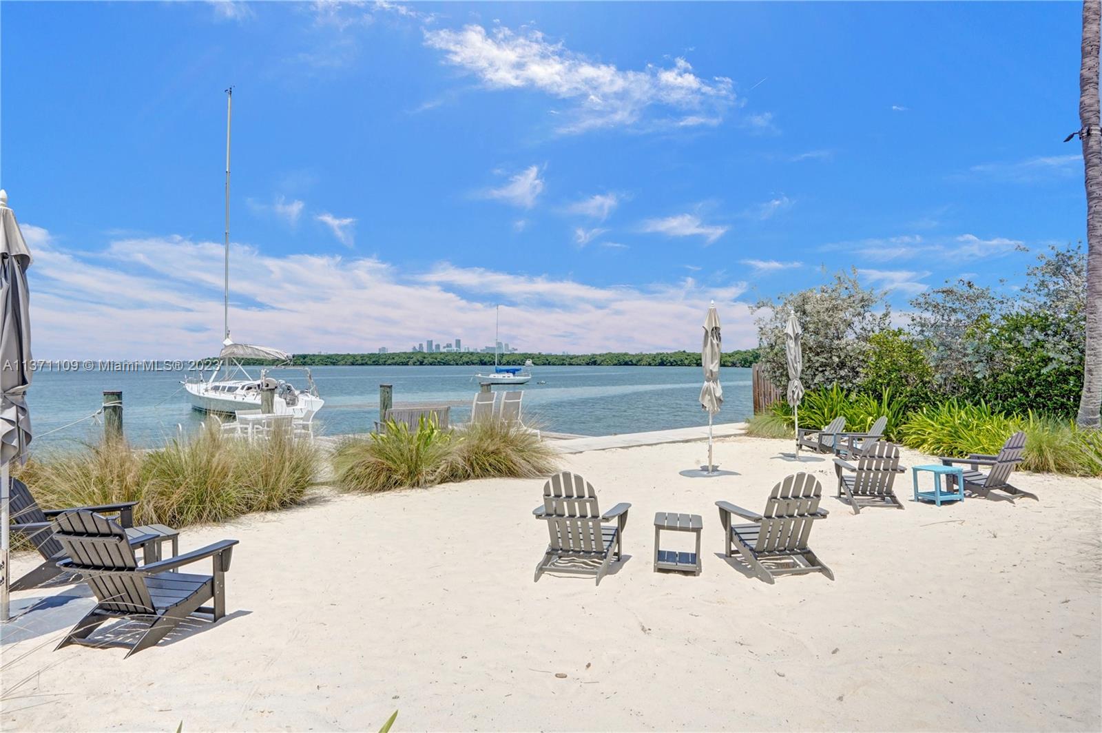 166 Harbor Drive, Unit 3C Key Biscayne, FL 33149 - Photo 45 of 78 a view of a lake with outdoor seating space