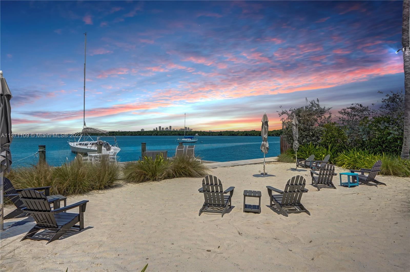 166 Harbor Drive, Unit 3C Key Biscayne, FL 33149 - Photo 46 of 78 a view of a terrace with furniture and garden