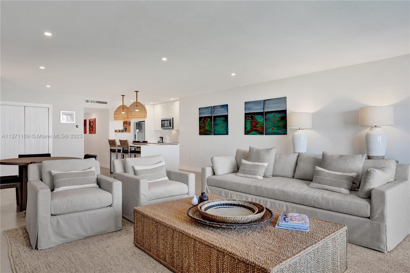 166 Harbor Drive, Unit 3C Key Biscayne, FL 33149 - Photo 5 of 78 a living room with furniture and a wooden floor