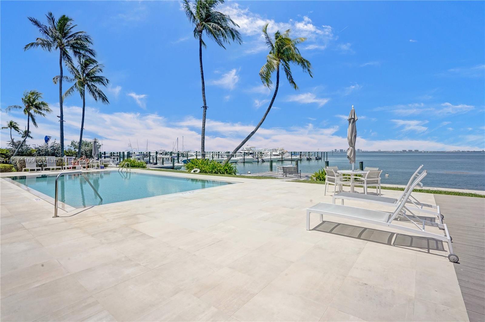 166 Harbor Drive, Unit 3C Key Biscayne, FL 33149 - Photo 51 of 78 a view of a terrace with palm trees