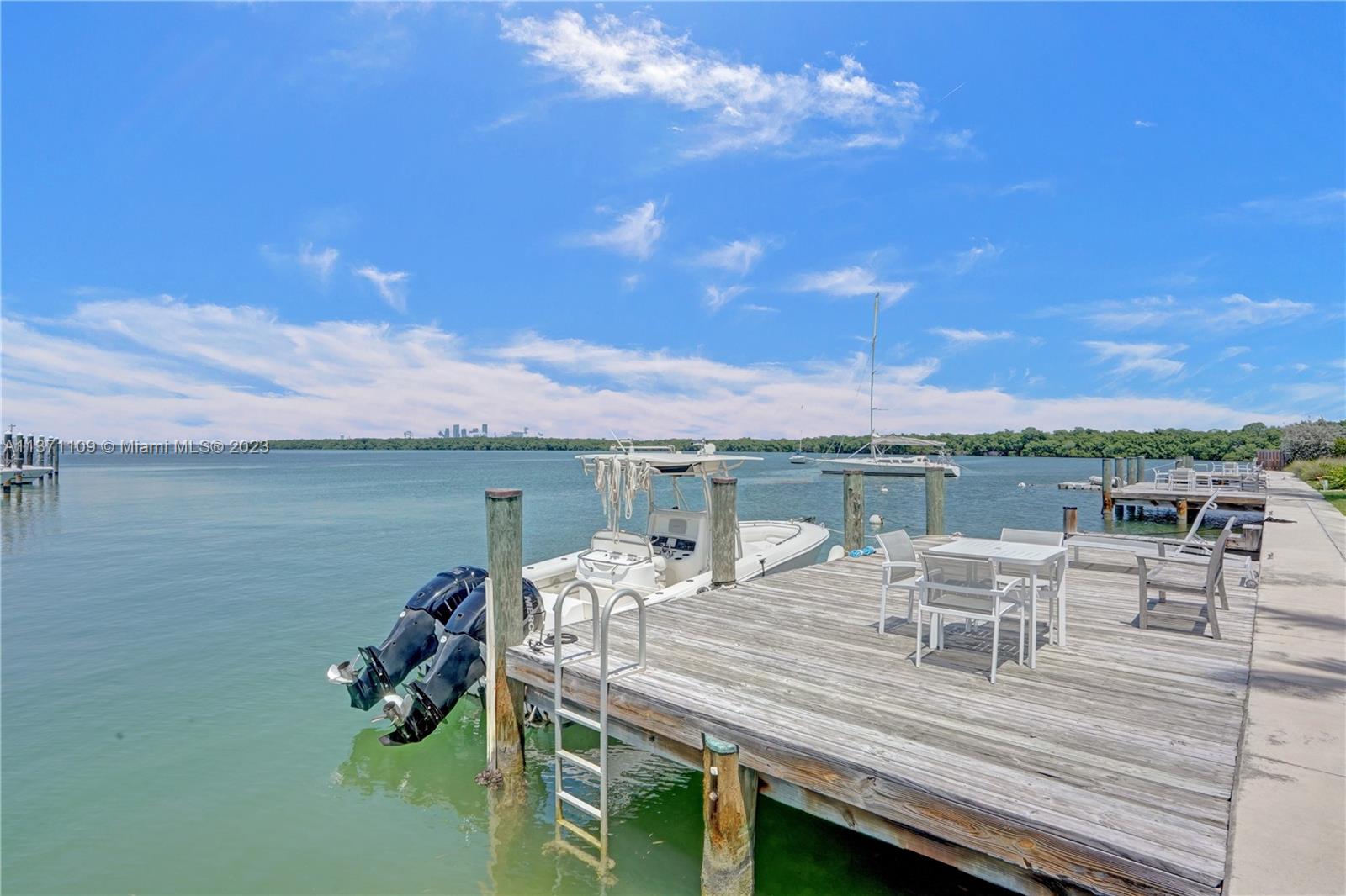 166 Harbor Drive, Unit 3C Key Biscayne, FL 33149 - Photo 54 of 78 a view of a roof deck with furniture