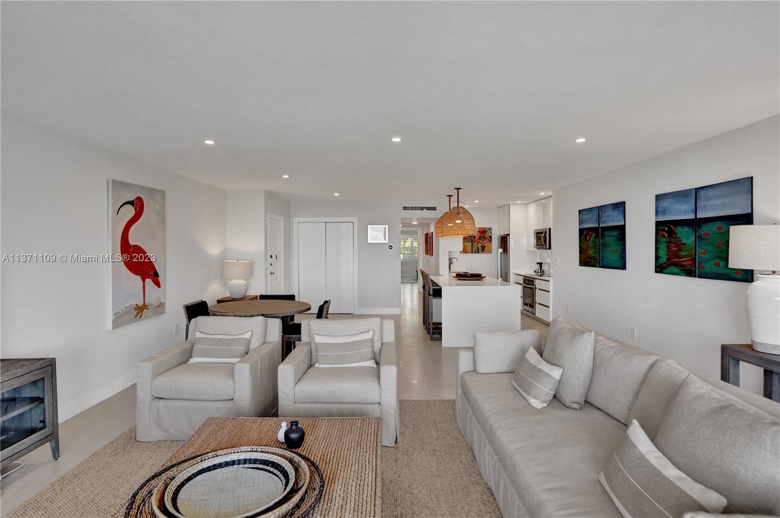 166 Harbor Drive, Unit 3C Key Biscayne, FL 33149 - Photo 6 of 78 a living room with furniture and a flat screen tv