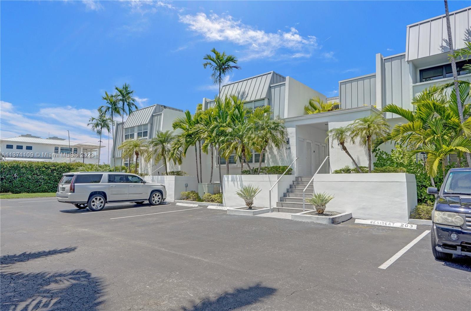 166 Harbor Drive, Unit 3C Key Biscayne, FL 33149 - Photo 62 of 78 a view of street with parked cars