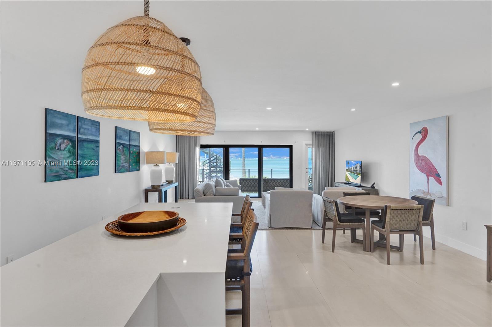 166 Harbor Drive, Unit 3C Key Biscayne, FL 33149 - Photo 8 of 78 a view of a dining room with furniture and chandelier