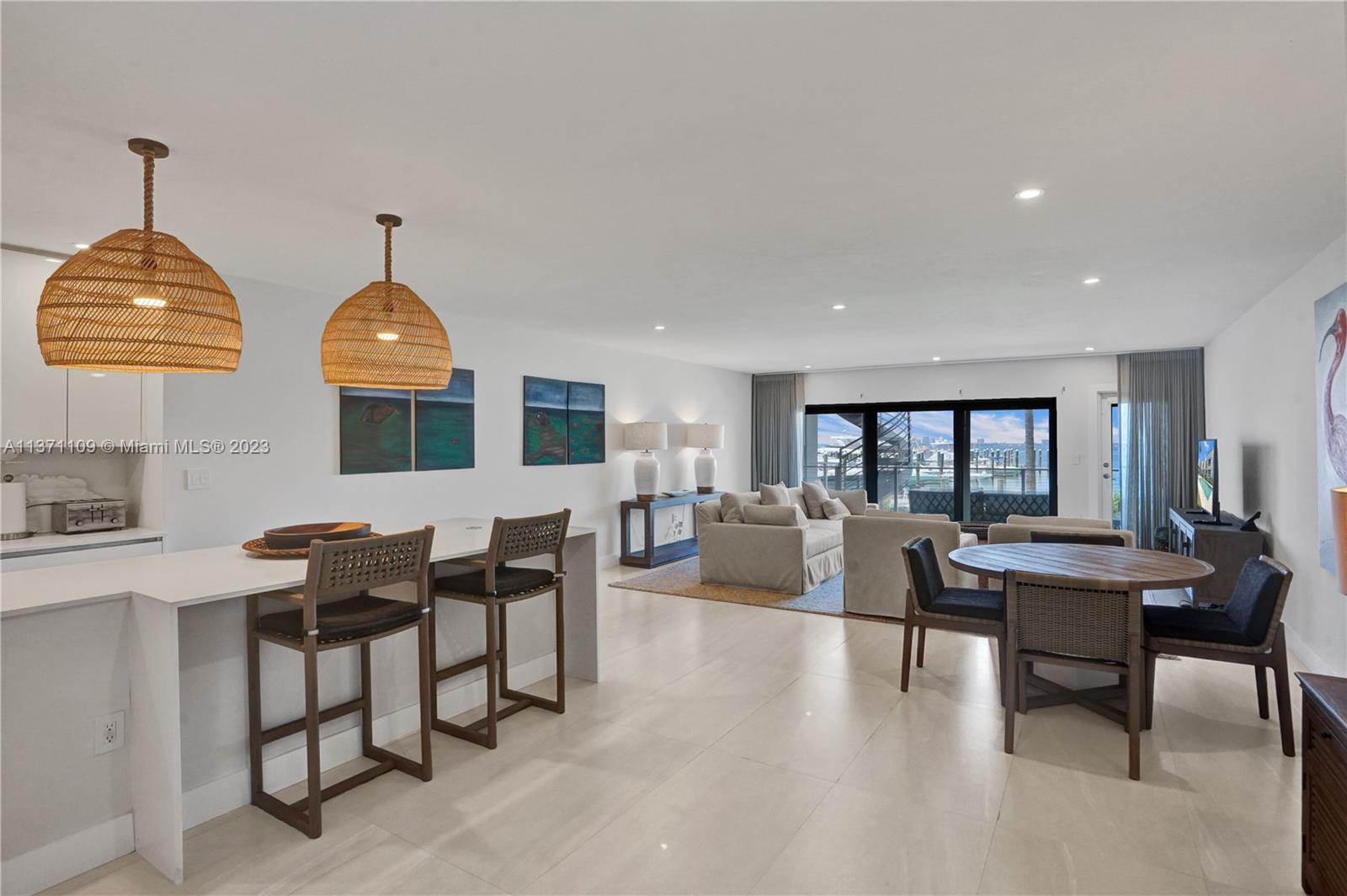 166 Harbor Drive, Unit 3C Key Biscayne, FL 33149 - Photo 9 of 78 a view of a dining room with furniture window and wooden floor
