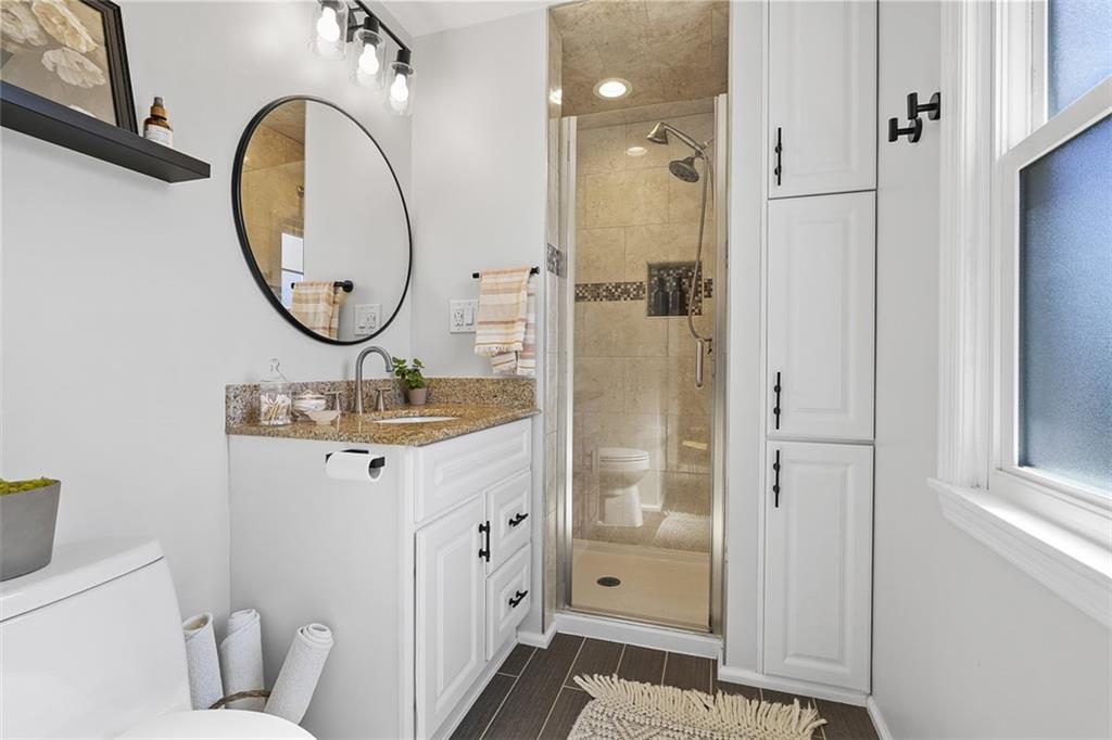 215 McIntyre Road Pittsburgh, PA 15237 - Photo 13 of 28 a bathroom with a sink mirror and toilet