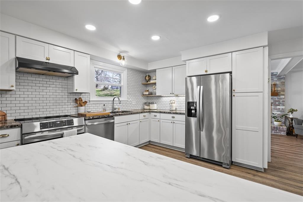 215 McIntyre Road Pittsburgh, PA 15237 - Photo 4 of 28 a kitchen with stainless steel appliances a refrigerator and a sink