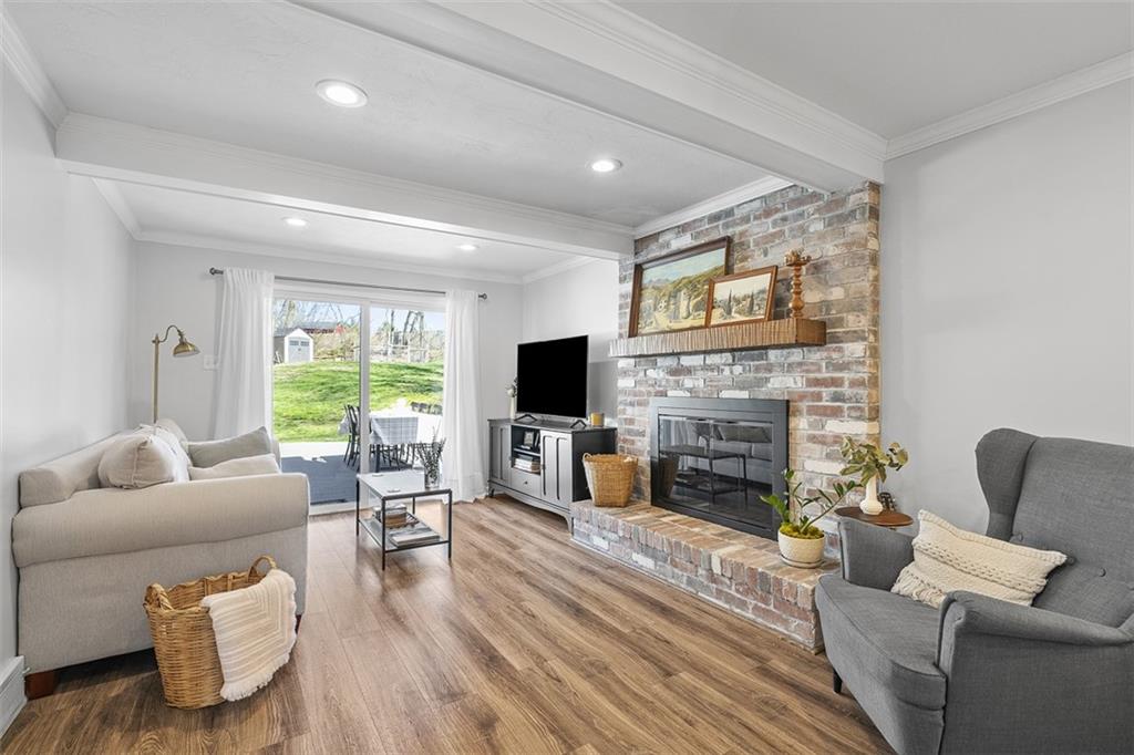 215 McIntyre Road Pittsburgh, PA 15237 - Photo 9 of 28 a living room with furniture and a fireplace