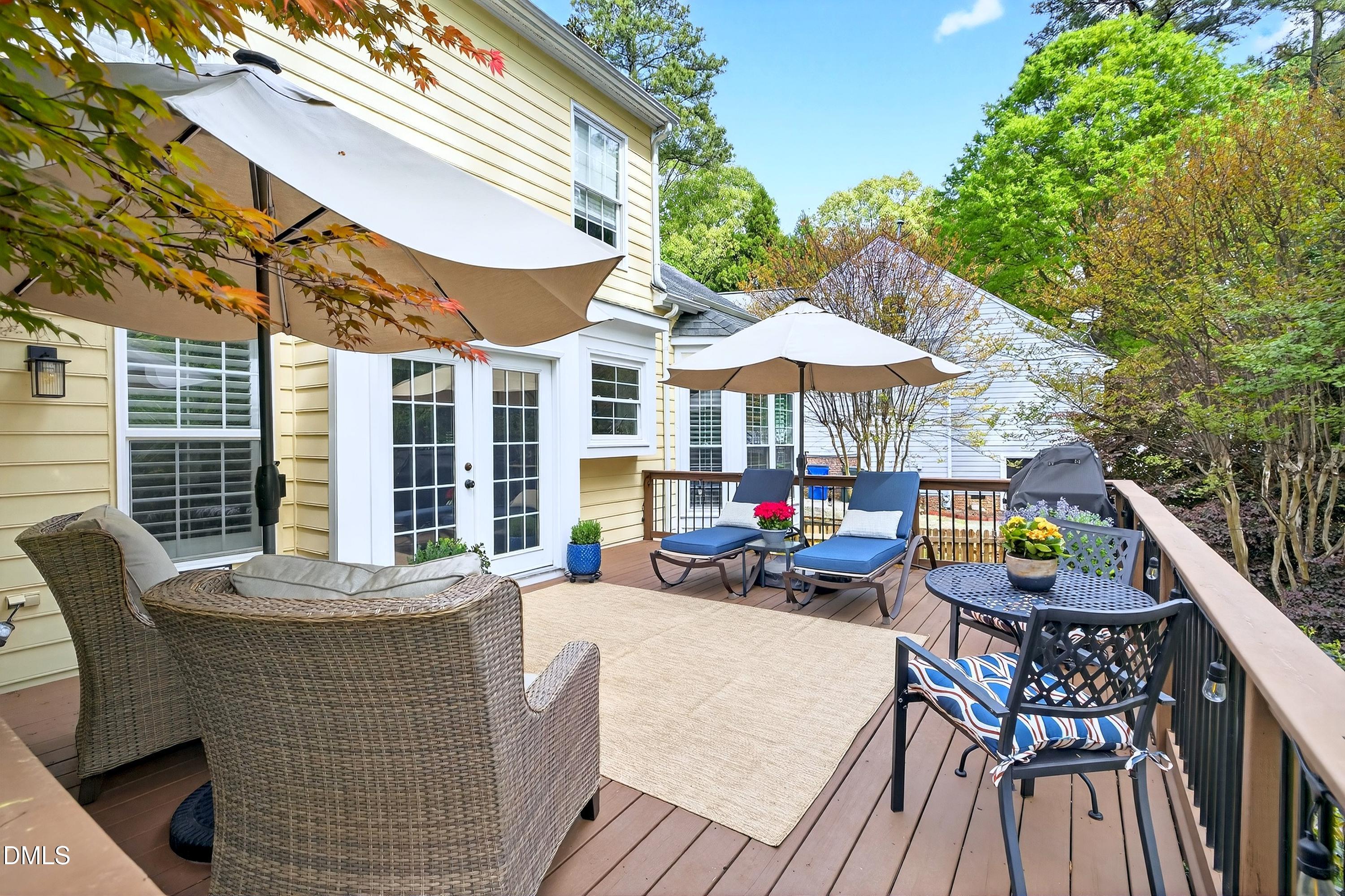 9432 Cartersville Court Raleigh, NC 27617 - Photo 45 of 66 a view of house with outdoor seating space and wooden floor