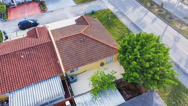 an aerial view of a house with a garden