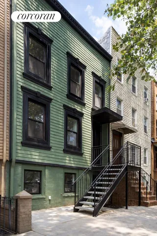 a front view of a building with many windows